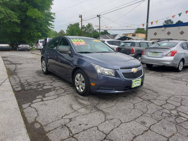 2014 Chevrolet Cruze for sale at DAGO'S AUTO SALES LLC in Dalton, GA