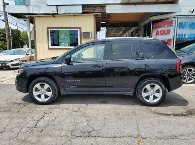 2016 Jeep Compass for sale at DAGO'S AUTO SALES LLC in Dalton, GA