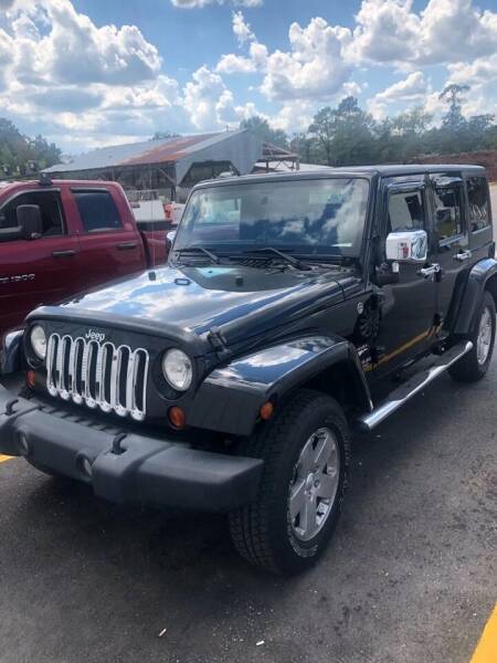 2012 Jeep Wrangler Unlimited for sale at Opulent Auto Group in Semmes AL