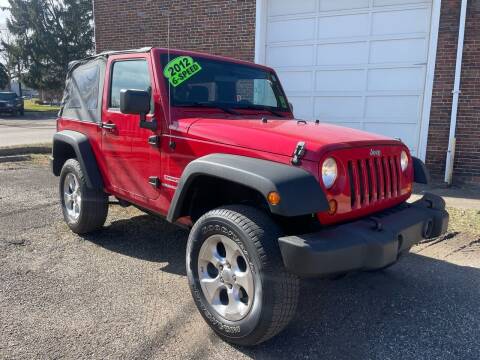 2012 Jeep Wrangler for sale at Jim's Hometown Auto Sales LLC in Byesville OH