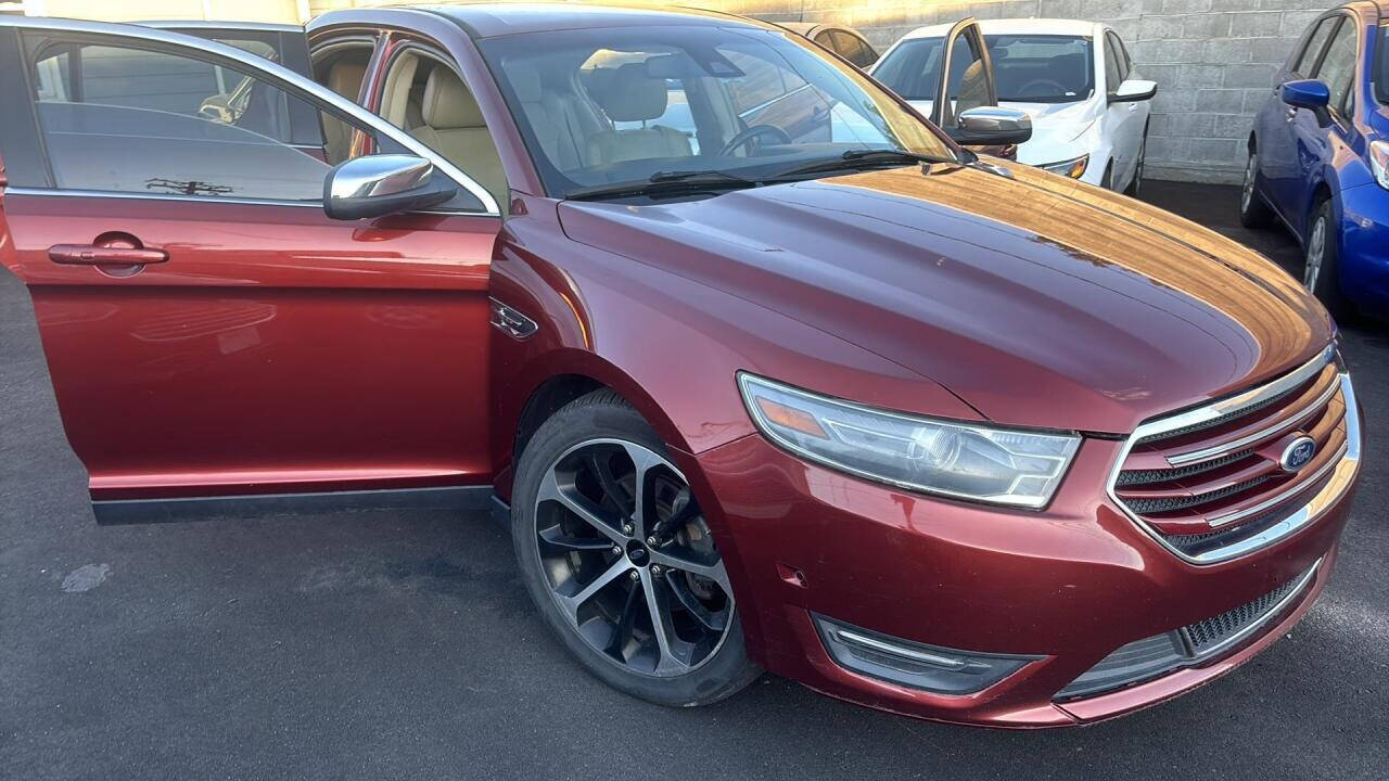 2014 Ford Taurus for sale at Ganda Auto Sales in Denver, CO