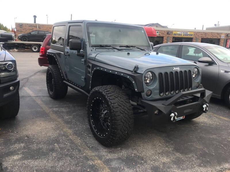 2015 Jeep Wrangler for sale at Carney Auto Sales in Austin MN