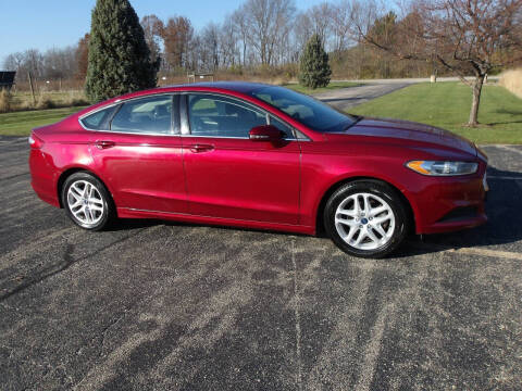 2013 Ford Fusion for sale at Crossroads Used Cars Inc. in Tremont IL