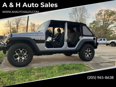 2015 Jeep Wrangler Unlimited for sale at A & H Auto Sales in Clanton AL