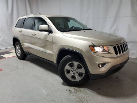 2014 Jeep Grand Cherokee for sale at Tradewind Car Co in Muskegon MI