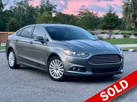 2014 Ford Fusion Hybrid for sale at EASYCAR GROUP in Orlando FL