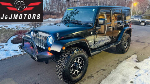 2012 Jeep Wrangler Unlimited for sale at J & J MOTORS in New Milford CT