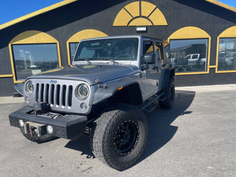 2014 Jeep Wrangler Unlimited for sale at BELOW BOOK AUTO SALES in Idaho Falls ID