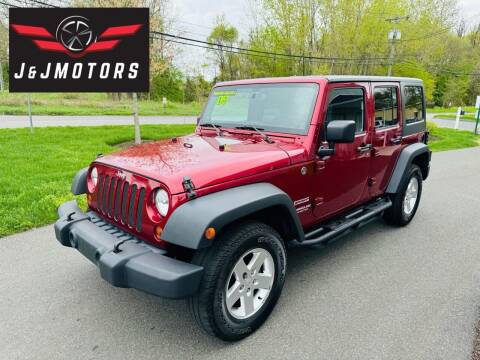 2013 Jeep Wrangler Unlimited for sale at J & J MOTORS in New Milford CT