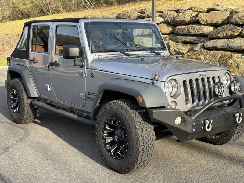 Used 2014 Jeep Wrangler Unlimited Sport with VIN 1C4BJWDG0EL192509 for sale in Saylorsburg, PA