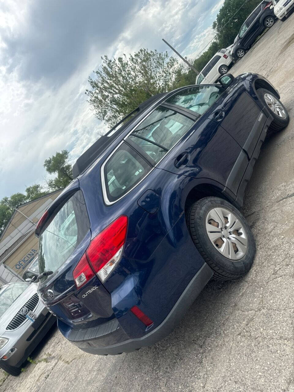 2011 Subaru Outback for sale at Calderon Auto Sales in Des Moines, IA