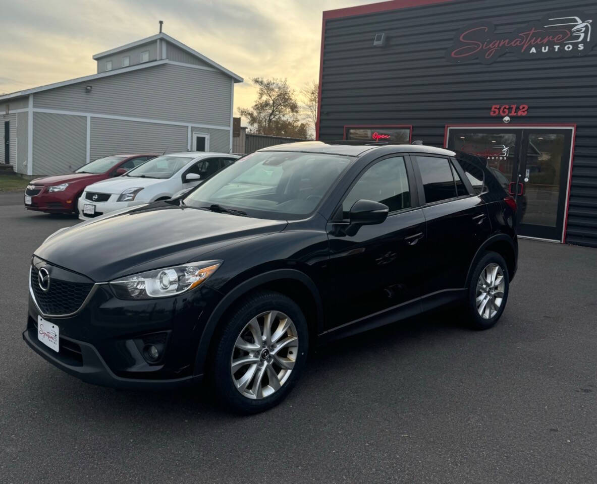 2015 Mazda CX-5 for sale at SIGNATURE AUTOS LLC in Weston, WI