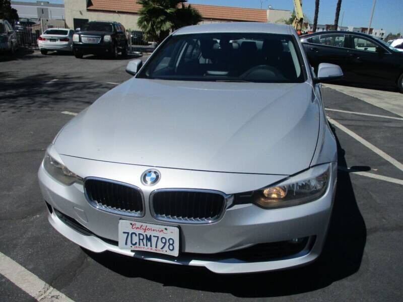 2014 BMW 3 Series for sale at Unique Auto Sales, Inc. in Bell, CA