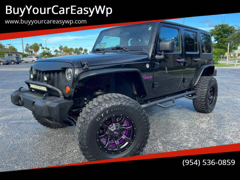 2012 Jeep Wrangler Unlimited for sale at BuyYourCarEasyWp in West Park FL