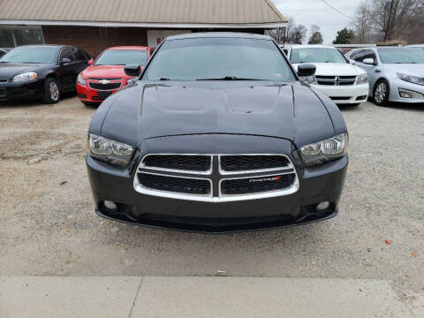 2014 Dodge Charger for sale at RAGINS AUTOPLEX in Kennett MO