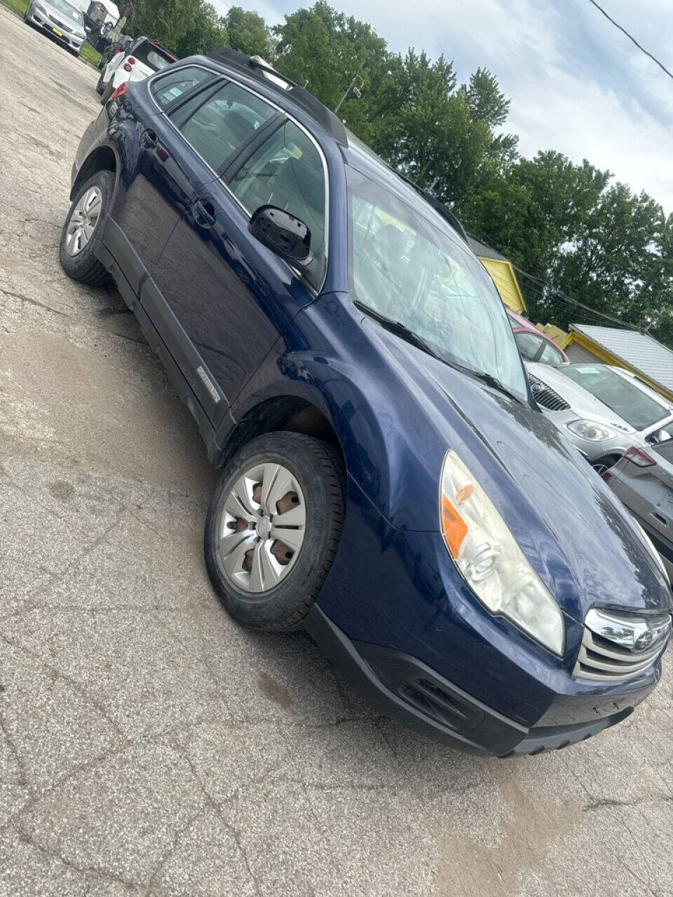 2011 Subaru Outback for sale at Calderon Auto Sales in Des Moines, IA