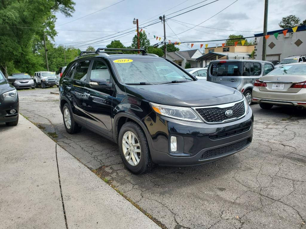 2014 Kia Sorento for sale at DAGO'S AUTO SALES LLC in Dalton, GA