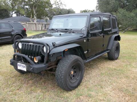 2011 Jeep Wrangler Unlimited for sale at Hartman's Auto Sales in Victoria TX