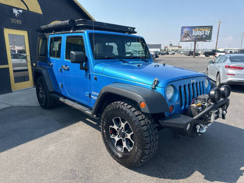 2010 Jeep Wrangler Unlimited for sale at BELOW BOOK AUTO SALES in Idaho Falls ID