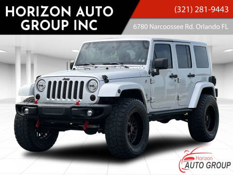 2012 Jeep Wrangler Unlimited for sale at HORIZON AUTO GROUP INC in Orlando FL