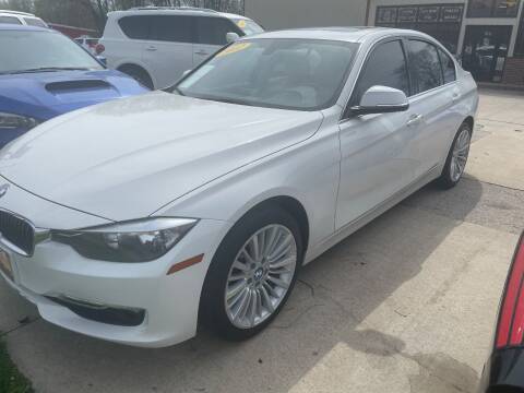 2012 BMW 3 Series for sale at Azteca Auto Sales LLC in Des Moines IA