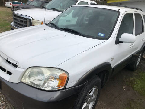 2006 Mazda Tribute for sale at Simmons Auto Sales in Denison TX