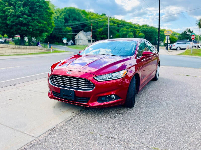 2013 Ford Fusion Hybrid for sale at Rams Auto Sales LLC in South Saint Paul MN