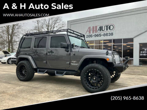 2016 Jeep Wrangler Unlimited for sale at A & H Auto Sales in Clanton AL