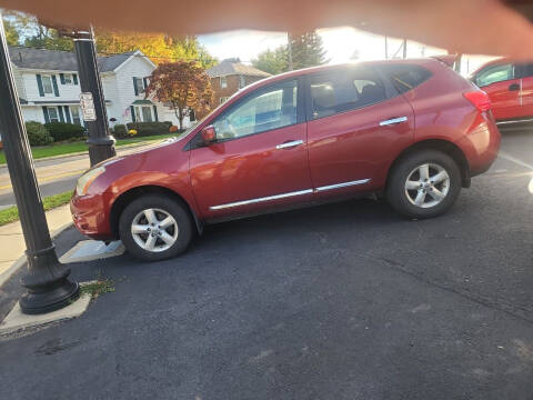 2013 Nissan Rogue for sale at Maximum Auto Group II INC in Cortland OH