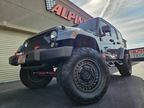 2014 Jeep Wrangler Unlimited for sale at Alpine Motors Certified Pre-Owned in Wantagh NY