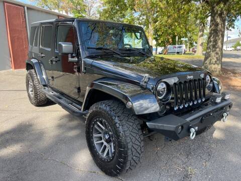 2015 Jeep Wrangler Unlimited for sale at International Motor Group LLC in Hasbrouck Heights NJ