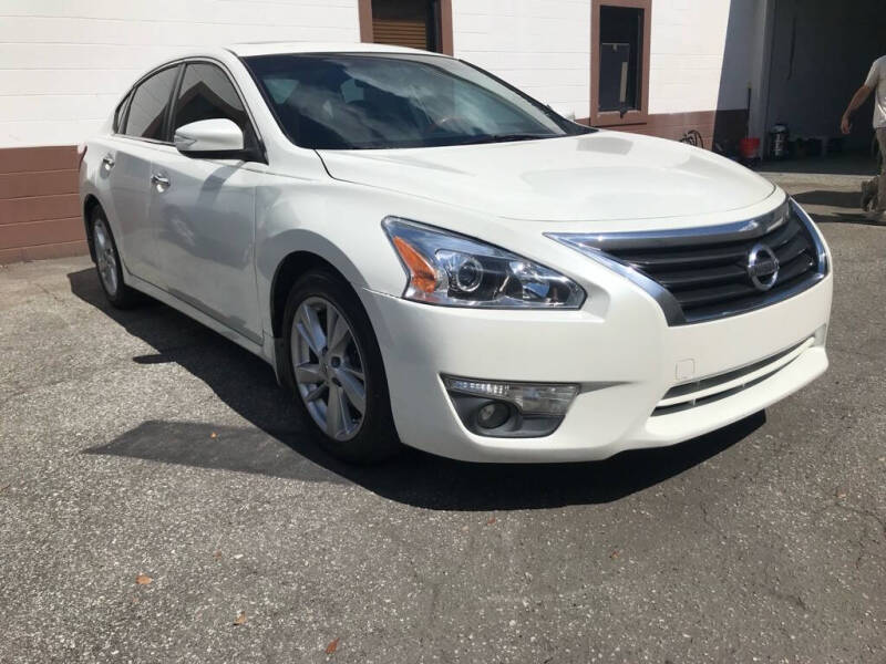 2013 Nissan Altima for sale at WHEEL UNIK AUTOMOTIVE & ACCESSORIES INC in Winter Park FL