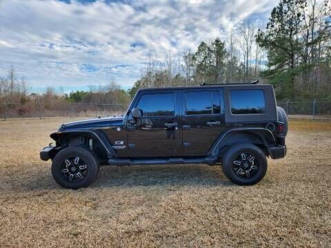 2009 Jeep Wrangler Unlimited for sale at Poole Automotive -Moore County in Aberdeen NC