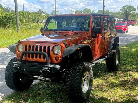 2011 Jeep Wrangler Unlimited for sale at VASS Automotive in Deland FL