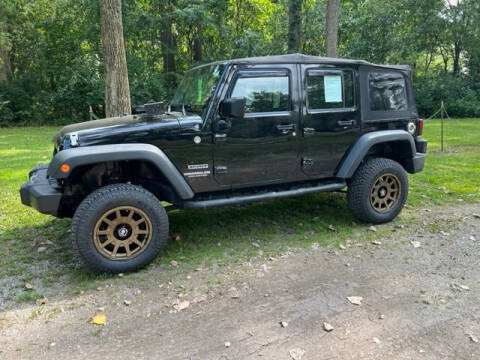 2010 Jeep Wrangler Unlimited for sale at The Car Mart in Milford IN