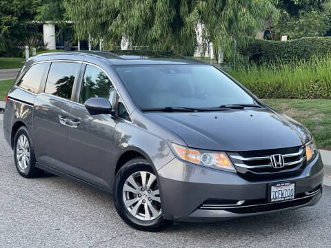 2014 Honda Odyssey for sale at MILLENNIUM MOTORS in Van Nuys CA