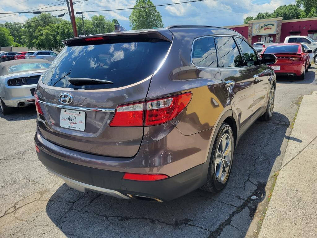 2015 Hyundai SANTA FE for sale at DAGO'S AUTO SALES LLC in Dalton, GA