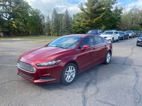 2014 Ford Fusion for sale at Northstar Auto Sales LLC in Ham Lake MN