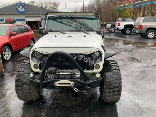 2013 Jeep Wrangler for sale at Chuckie Bizzarro's Fleetwing Auto in Erie, PA