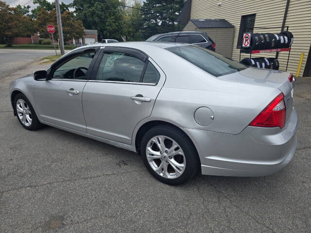 2012 Ford Fusion for sale at QUEENSGATE AUTO SALES in York, PA