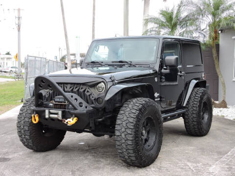 2011 Jeep Wrangler for sale at Auto Whim in Miami FL