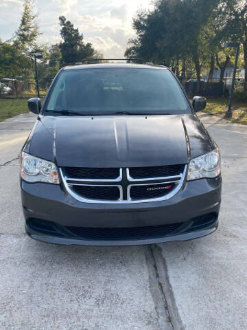 2015 Dodge Grand Caravan for sale at UNIVERSAL AUTO GROUP in Orlando FL