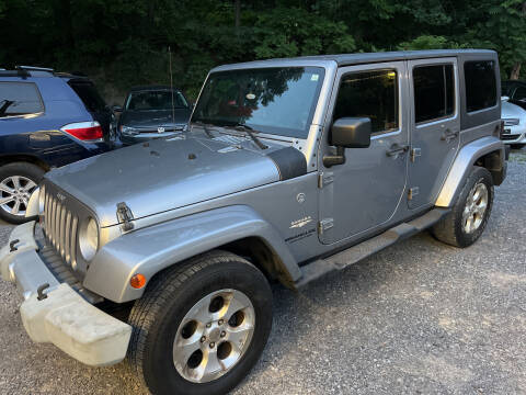 2013 Jeep Wrangler Unlimited for sale at Apple Auto Sales Inc in Camillus NY