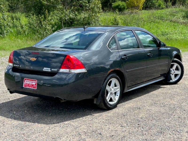 Used 2014 Chevrolet Impala 2FL with VIN 2G1WB5E38E1180935 for sale in Iron River, MI