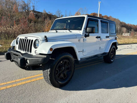 2016 Jeep Wrangler Unlimited for sale at Jim's Hometown Auto Sales LLC in Cambridge OH