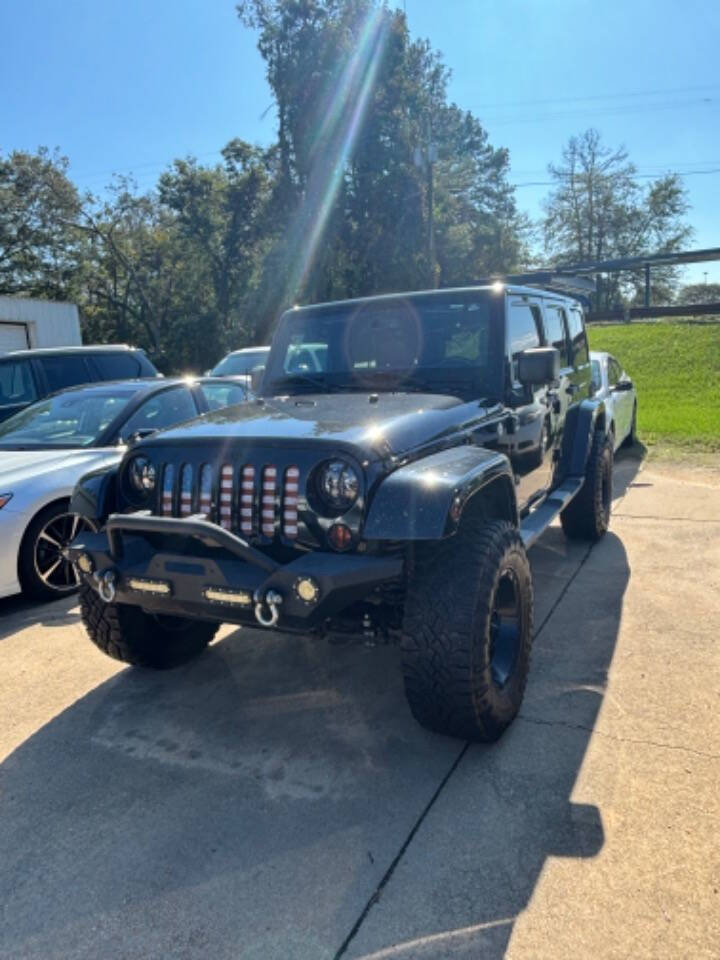 2013 Jeep Wrangler Unlimited for sale at Good Cars and Trucks Wholesale, LLC in Crystal Springs, MS