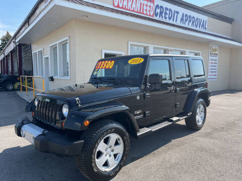 2011 Jeep Wrangler Unlimited for sale at Suarez Auto Sales in Port Huron MI