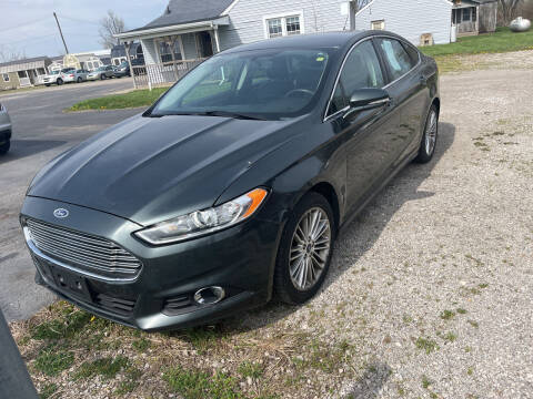 2016 Ford Fusion for sale at HEDGES USED CARS in Carleton MI