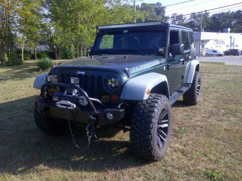 2012 Jeep Wrangler Unlimited for sale at Triangle Auto Sales in Elgin IL