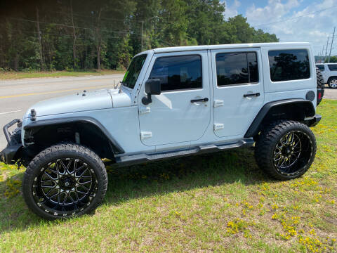 2012 Jeep Wrangler Unlimited for sale at TOP OF THE LINE AUTO SALES in Fayetteville NC